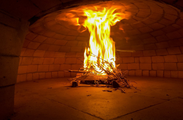 A deep wood-oven fire