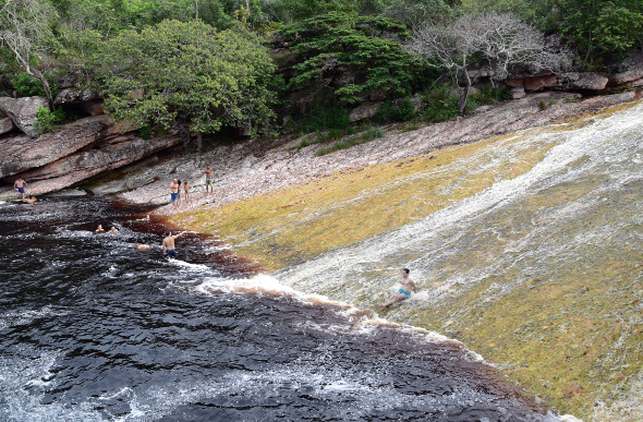 People swimming in a lagoon