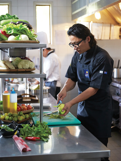 Luke Nguyen working in the kitchen