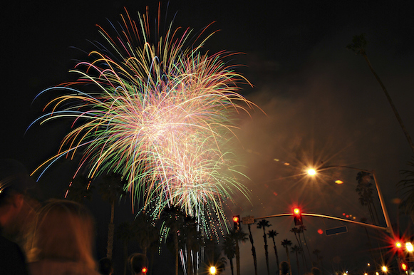 Bastille Day fireworks with palm trees. 