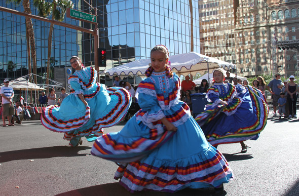 Young females in traditional Mexican dress in Downtown Phoenix to celebrate Cinco de Mayo