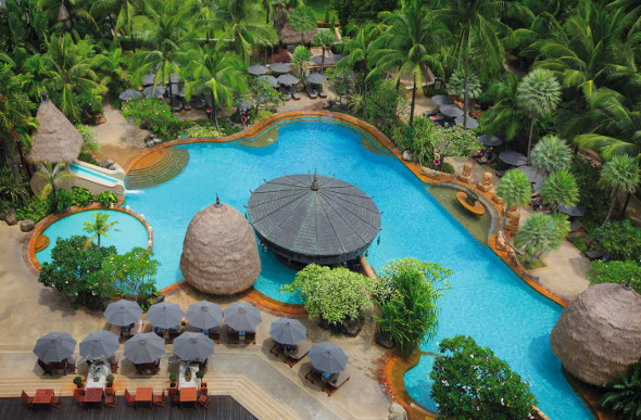 An inviting pool in the lush tropical gardens of the Movenpick Resort & Spa Karon Beach in Phuket, Thailand.