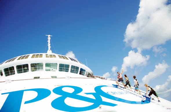 Passengers climbing the bow of a cruise ship