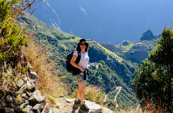 A woman admires the view on a trek through the Sacred Valley of Peru. 