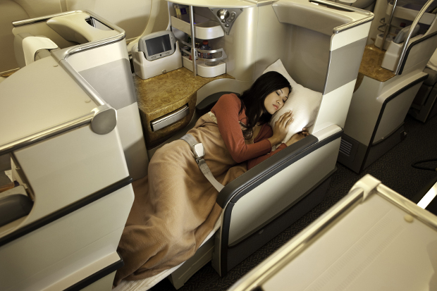 A woman in one of the Business Class lie-flat seats