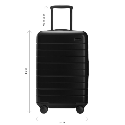 An Away carry-on suitcase with measurements highlighted