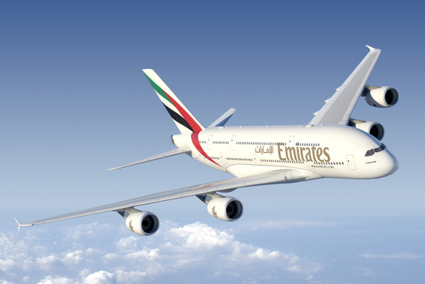 An Emirates A380 flying through the air