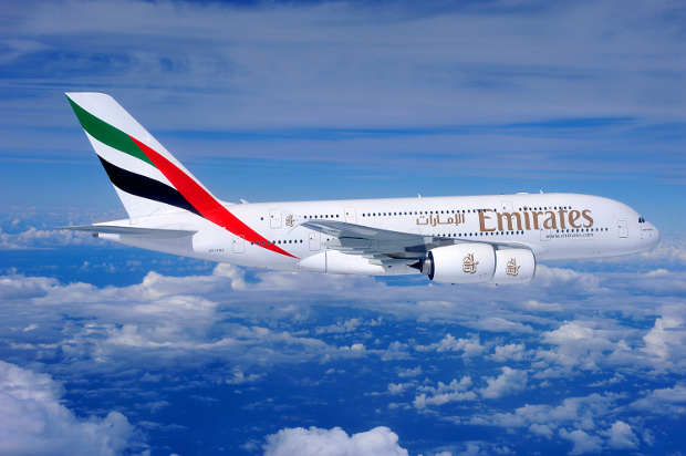 An Emirates A380 flying through the skies